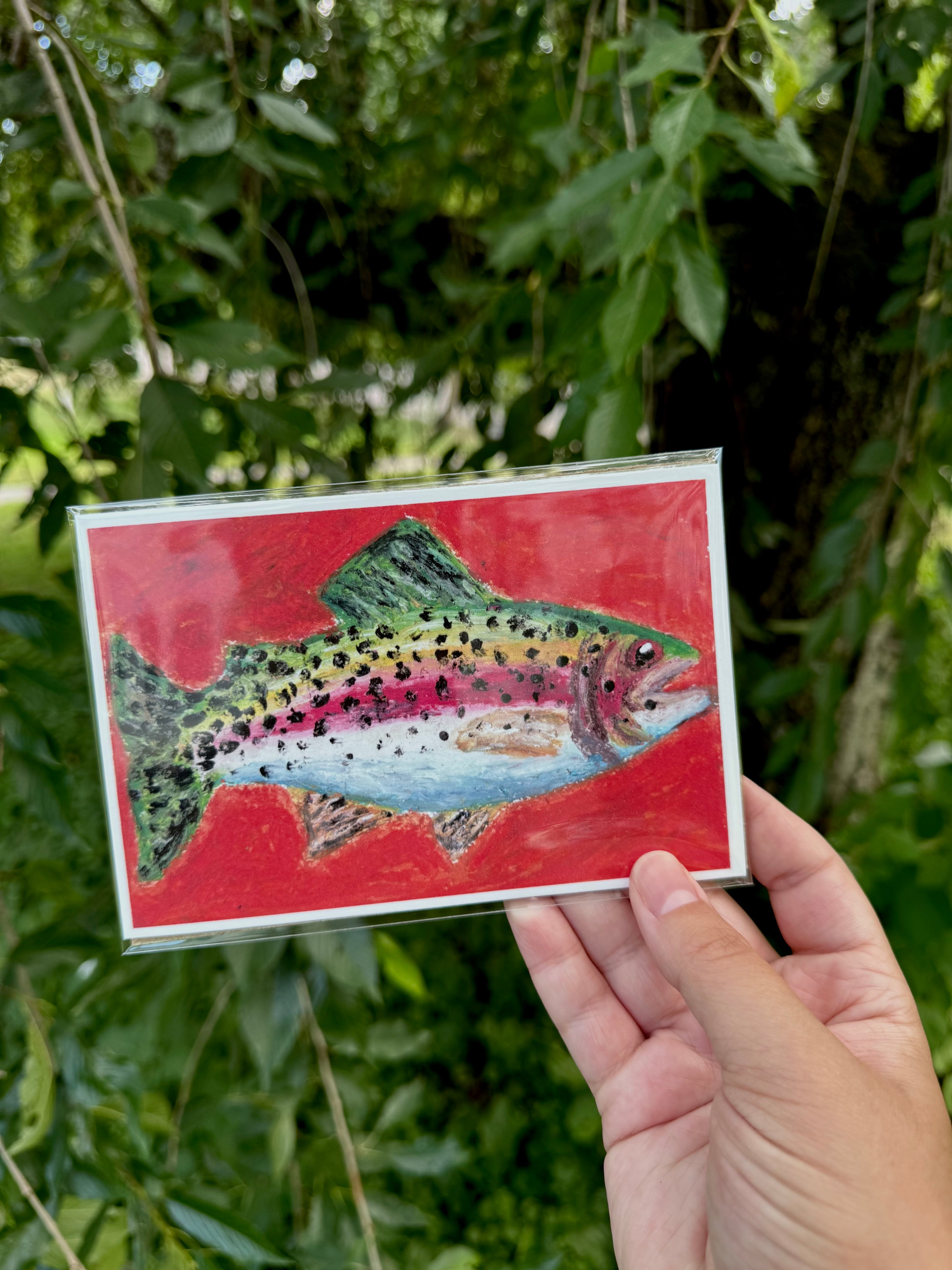 Close-up detail of rainbow trout oil pastel artwork – layered texture and color