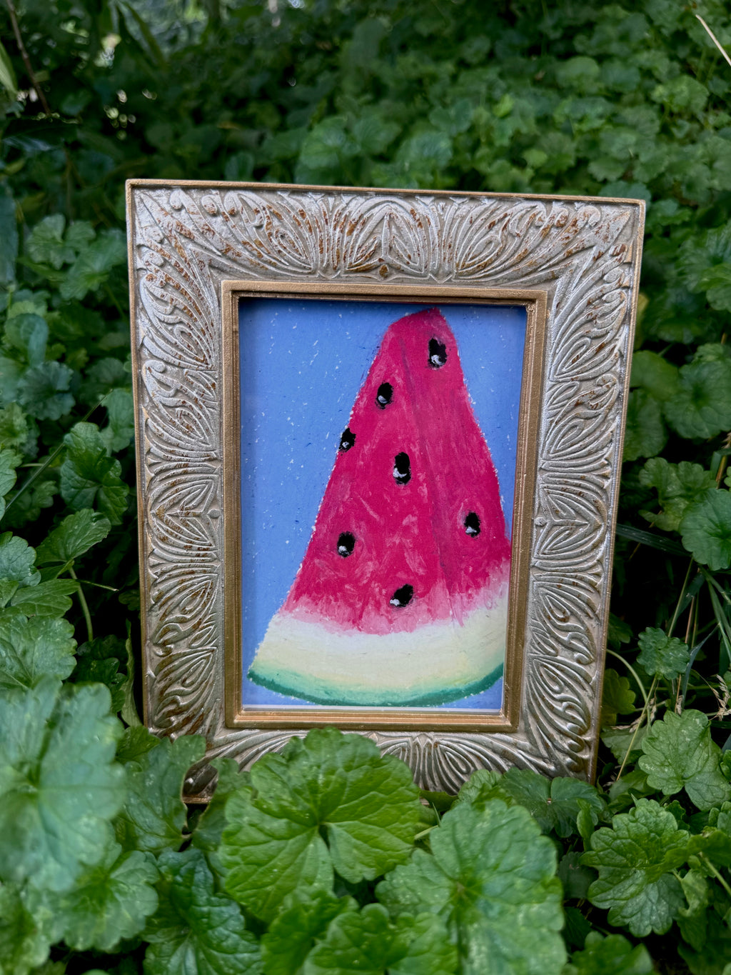 Framed watermelon oil pastel print displayed on wall – gallery art