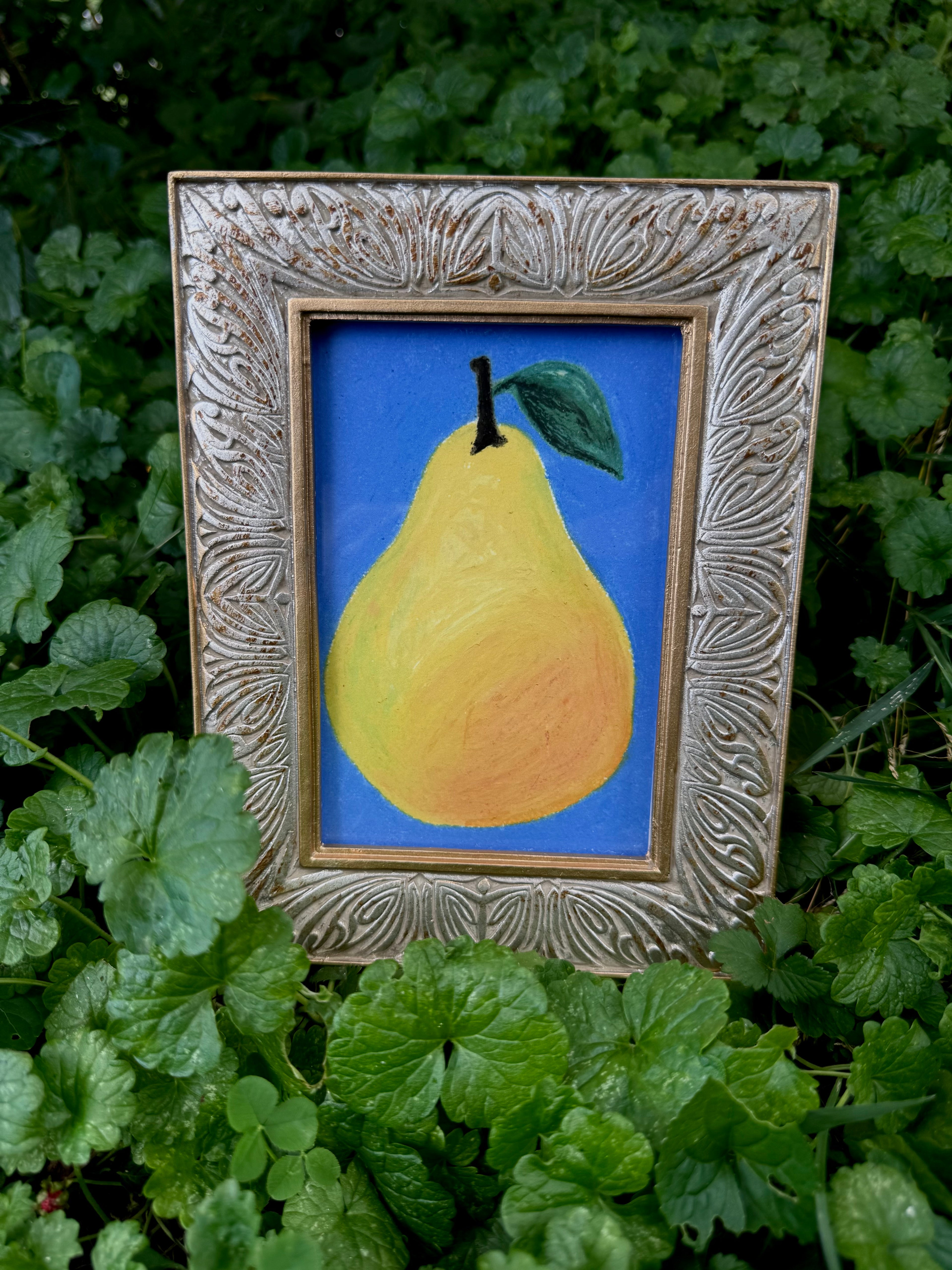 Framed pear oil pastel print displayed on wall – gallery art